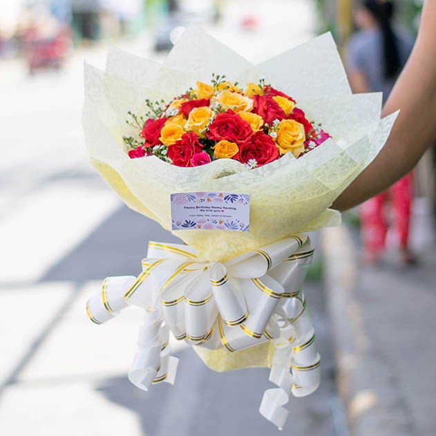 Hand bouquet of assorted roses