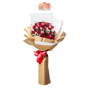 A hand-tied bouquet consists of 24 red roses and aster flower wrapped in gold and white wrapper