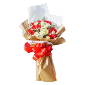 Bouquet of red and white roses with white aster fillers, wrapped in gold and white paper with a large red ribbon.