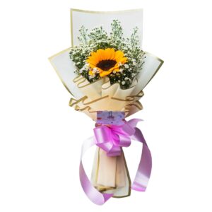 A bouquet featuring a single vibrant sunflower surrounded by white aster fillers, wrapped in cream and gold-toned paper with a pink satin ribbon