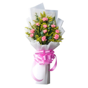 Pink carnation bouquet with green fillers wrapped in white paper and finished with a pink ribbon