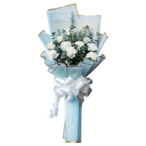 Fresh white carnation flower bouquet with eucalyptus greenery in pastel blue wrapping