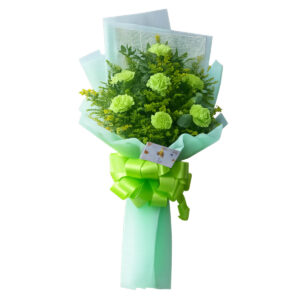 A fresh green carnation bouquet elegantly arranged with lush foliage, wrapped in soft mint green paper and finished with a vibrant green ribbon bow