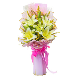 Fresh white lily bouquet with pastel pink and gold wrapper